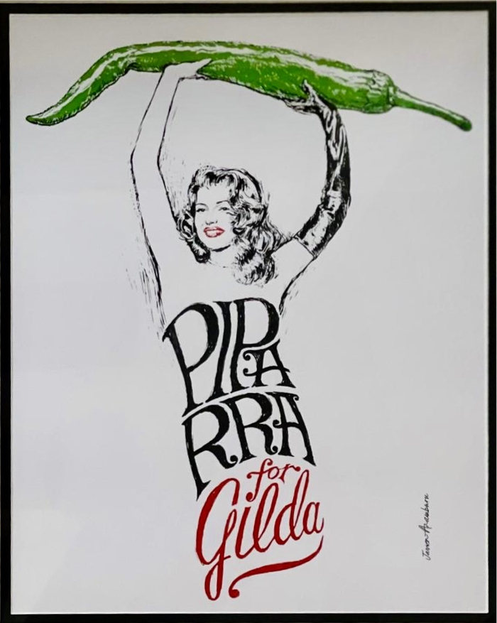 A graphic print of Rita Hayworth as Gilda, holding a piparra pepper above her head, by Javier Aramburu